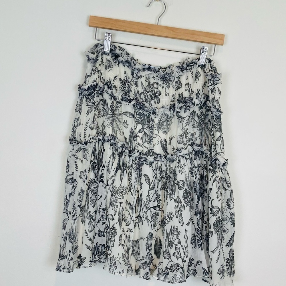 Badgley Mischka while with black floral silk chiffon skirt with ruffle detail.10